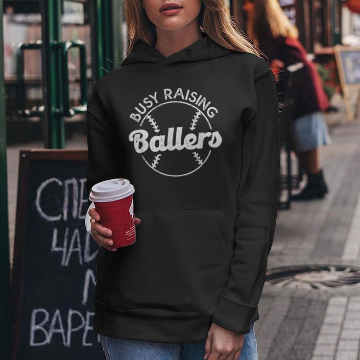 Baseball Dad Busy Raising Ballers Mom Of Baseball Players Women Hoodie Unique Gifts