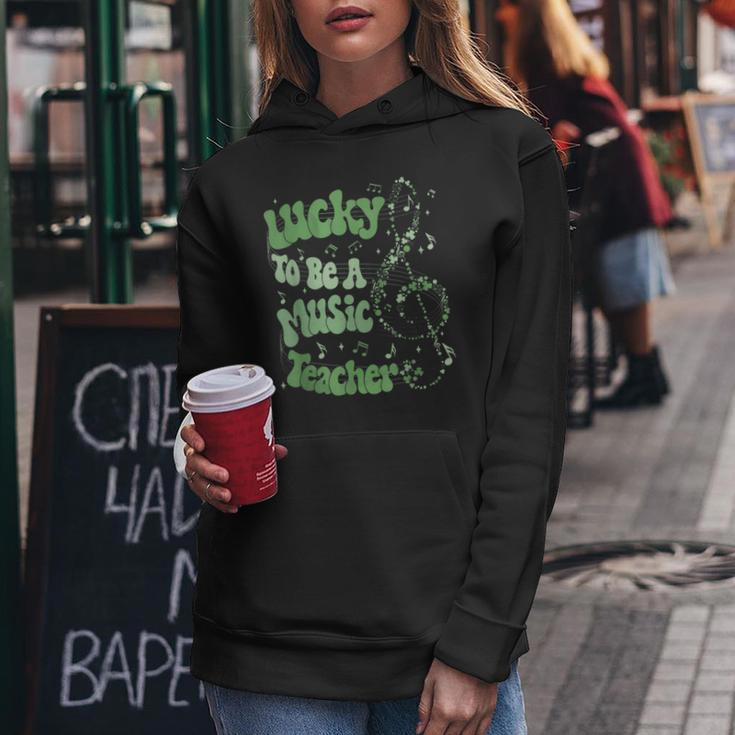 Retro Groovy Lucky To Be A Music Teacher St Patrick's Day Women Hoodie Personalized Gifts