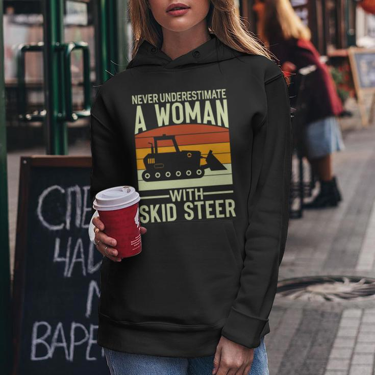 Never Underestimate A Woman With A Skid Sr Construction Women Hoodie Personalized Gifts
