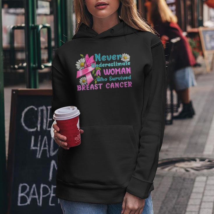 Never Underestimate A Woman Who Survived Breast Cancer Women Hoodie Unique Gifts