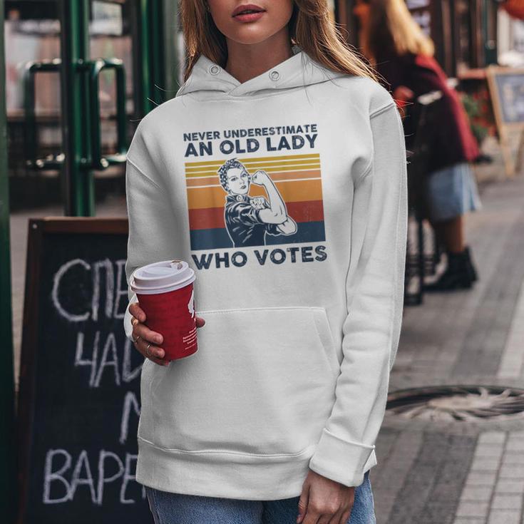 Never Underestimate An Old Lady Who Votes Feminist Women Hoodie Unique Gifts