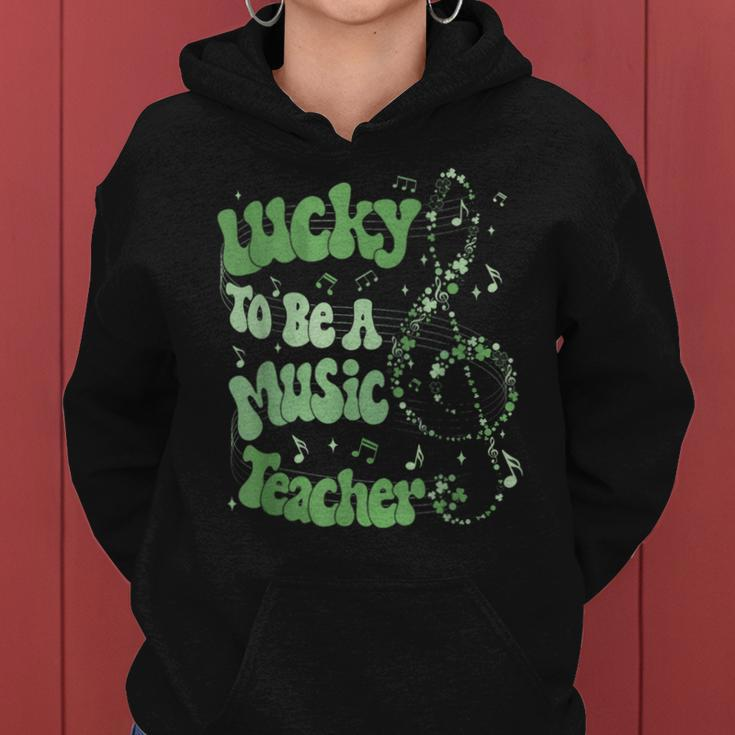 Retro Groovy Lucky To Be A Music Teacher St Patrick's Day Women Hoodie