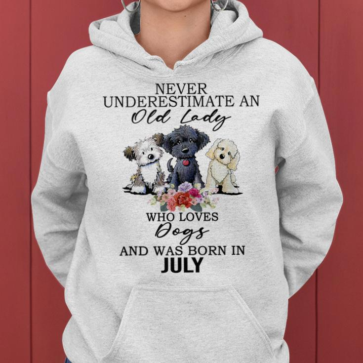 Never Underestimate An Old Lady Who Loves Dogs-July Women Hoodie