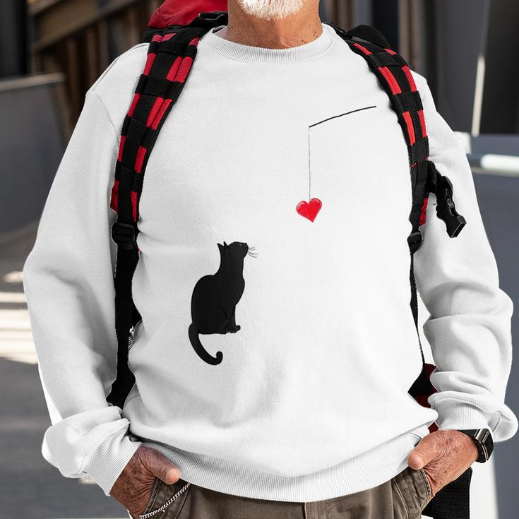 Cute Valentine's Day With A Cat Looking At A Heart Sweatshirt Gifts for Old Men