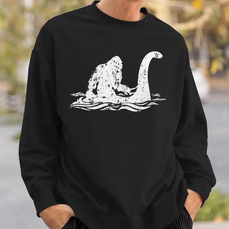 Bigfoot Riding On Nessie Lochness Monster Nessie Yeti Hunter Sweatshirt Gifts for Him