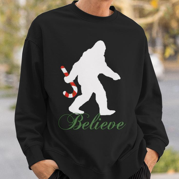 Bigfoot Sasquatch Yeti Believe Candy Cane Christmas Pajamas Sweatshirt Gifts for Him