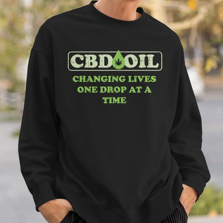 Cbd Oil Changing Lives One Drop At A Time Hemp Slogan Sweatshirt Gifts for Him