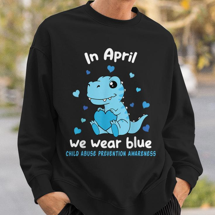 Dino In April We Wear Blue Child Abuse Prevention Awareness Sweatshirt Gifts for Him
