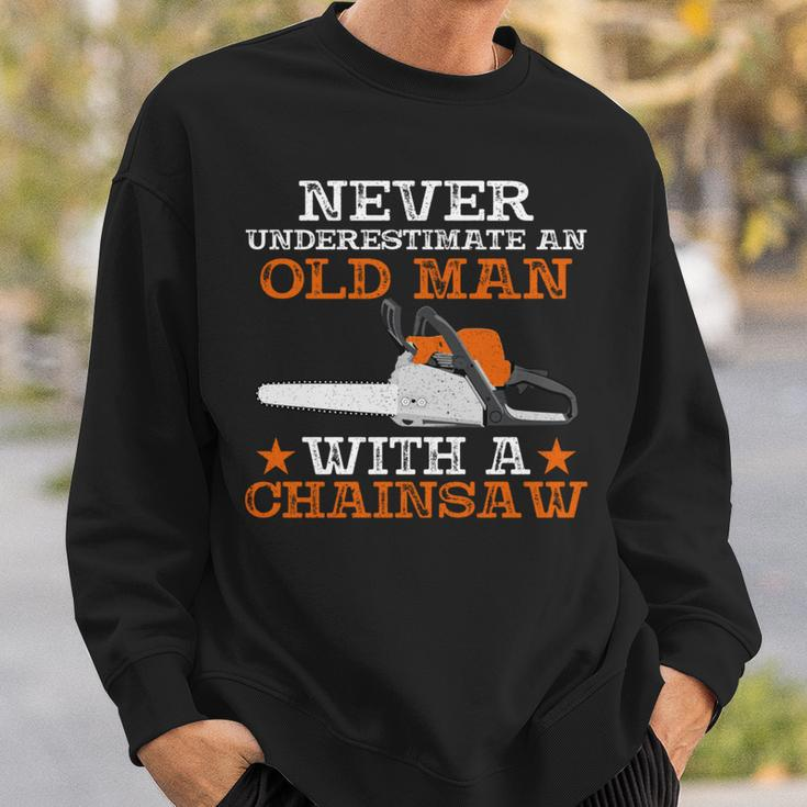 Never Underestimate An Old Man With Chainsaw Lumberjack Wood Sweatshirt Gifts for Him