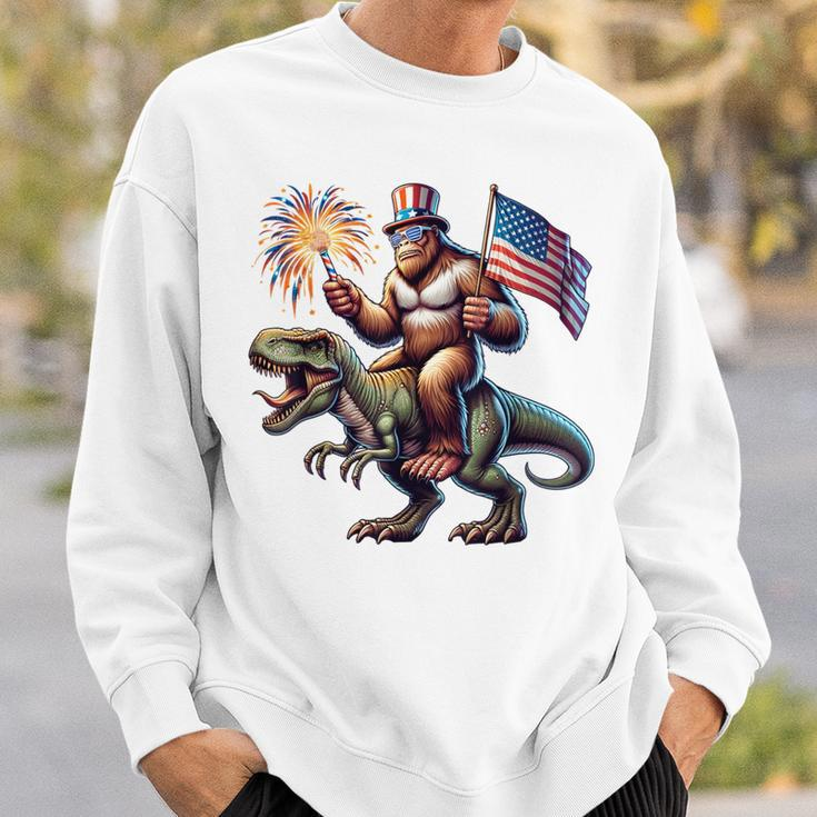Bigfoot Sasquatch Riding DinosaurRex 4Th Of July Sweatshirt Gifts for Him