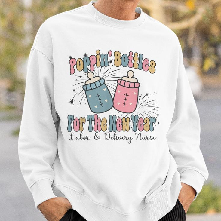 Poppin' Bottles For The New Year 2024 Labor And Delivery Sweatshirt Gifts for Him