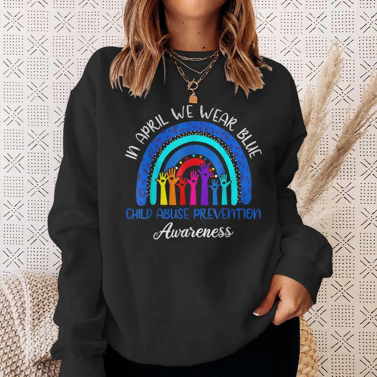 In April We Wear Blue Child Abuse Awareness Rainbow Sweatshirt Gifts for Her