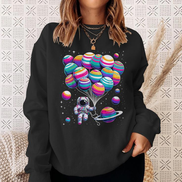 Astronaut Holding Planet Balloons Stem Science Sweatshirt Gifts for Her