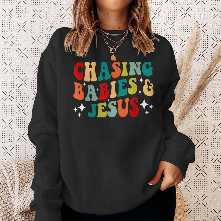 Chasing Babies And Jesus Chasing Babies & Jesus Christian Sweatshirt Gifts for Her
