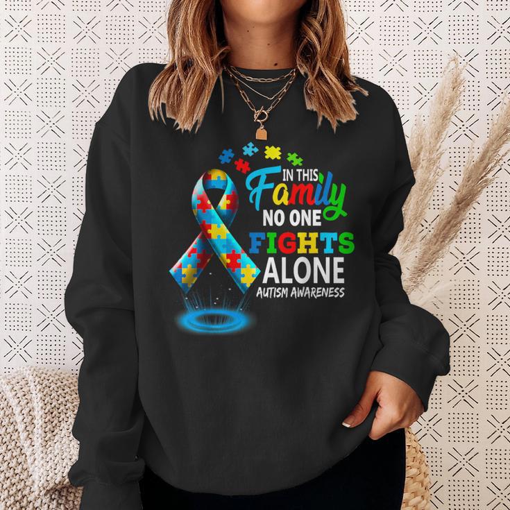 In This Family Nobody Fights Alone Blue Autism Awareness Sweatshirt Gifts for Her