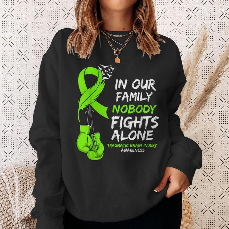 In Our Family Nobody Fights Alone Traumatic Brain Injury Sweatshirt Gifts for Her