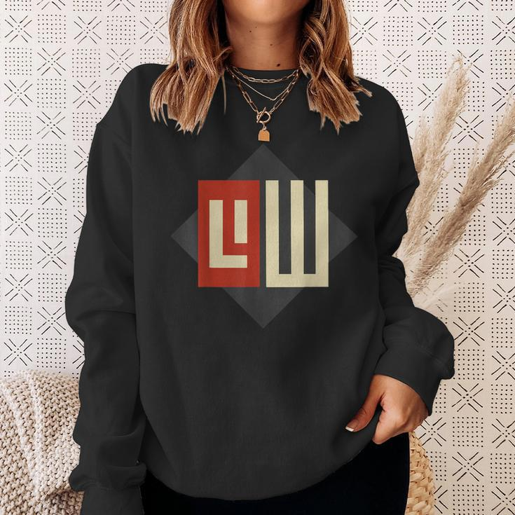 Geometrisches Sweatshirt Schwarz mit stylisiertem Buchstaben-Design Geschenke für Sie