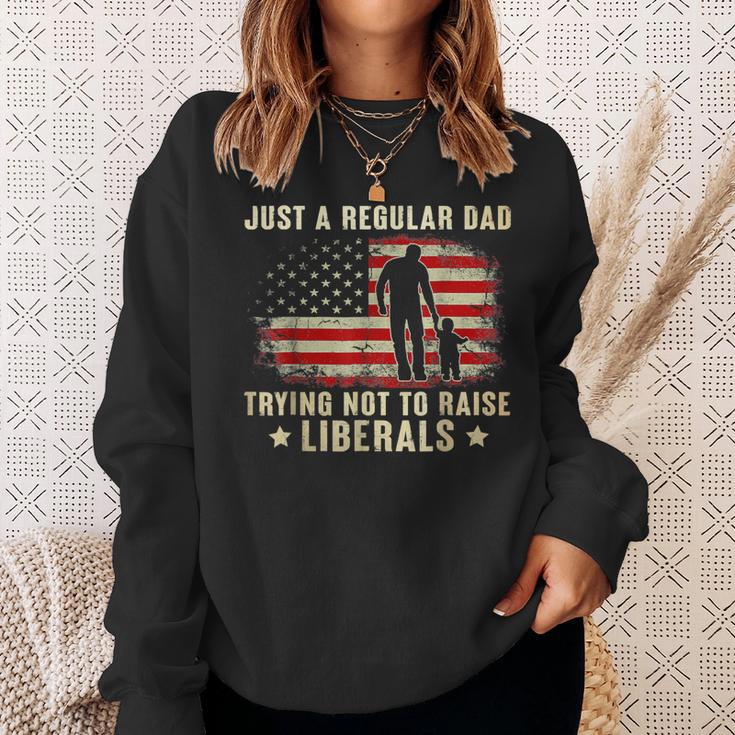 Just A Regular Dad Trying Not To Raise Liberals Father's Day Sweatshirt Gifts for Her