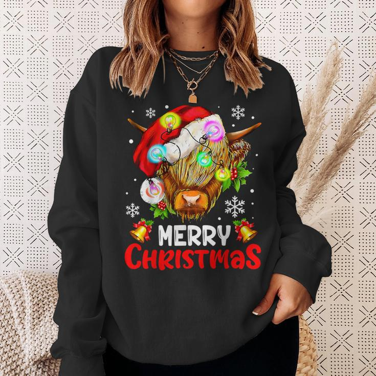 Merry Christmas Highland Cow Western Santa Hat Xmas Pajamas Sweatshirt Gifts for Her