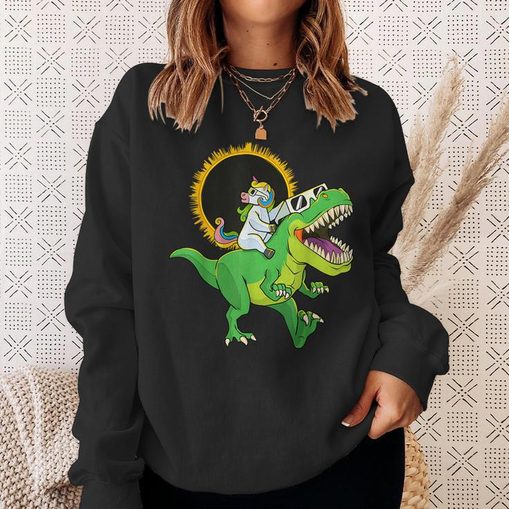 Solar Eclipse 2024 Unicorn Riding T-Rex Dinosaur Boys Sweatshirt Gifts for Her