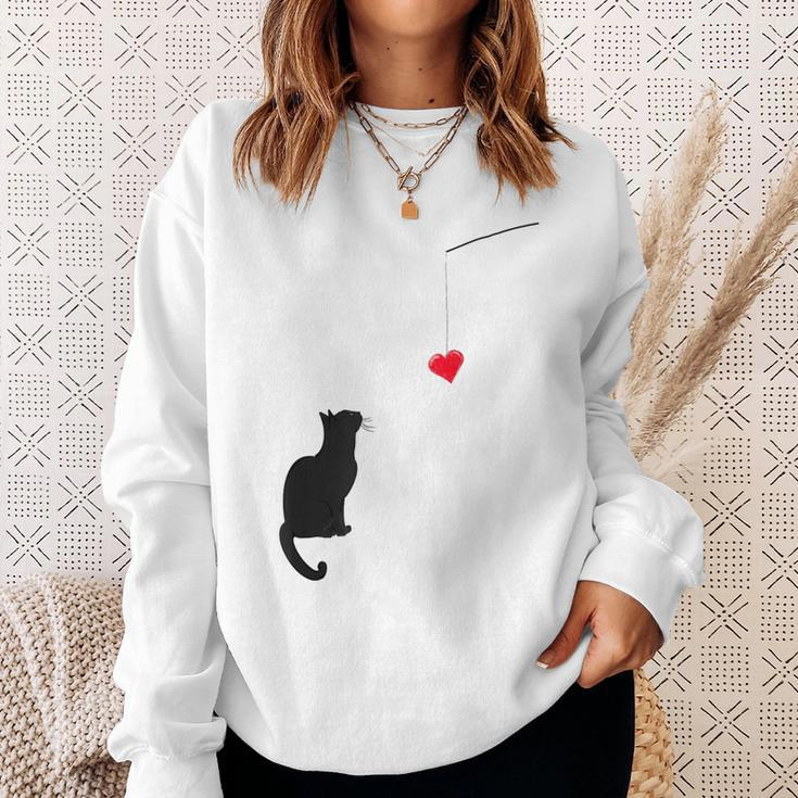 Cute Valentine's Day With A Cat Looking At A Heart Sweatshirt Gifts for Her