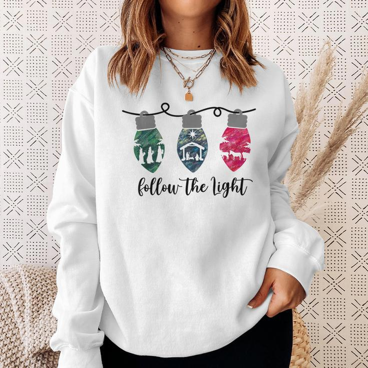 Follow The Light Christ Xmas Light Sweatshirt Gifts for Her