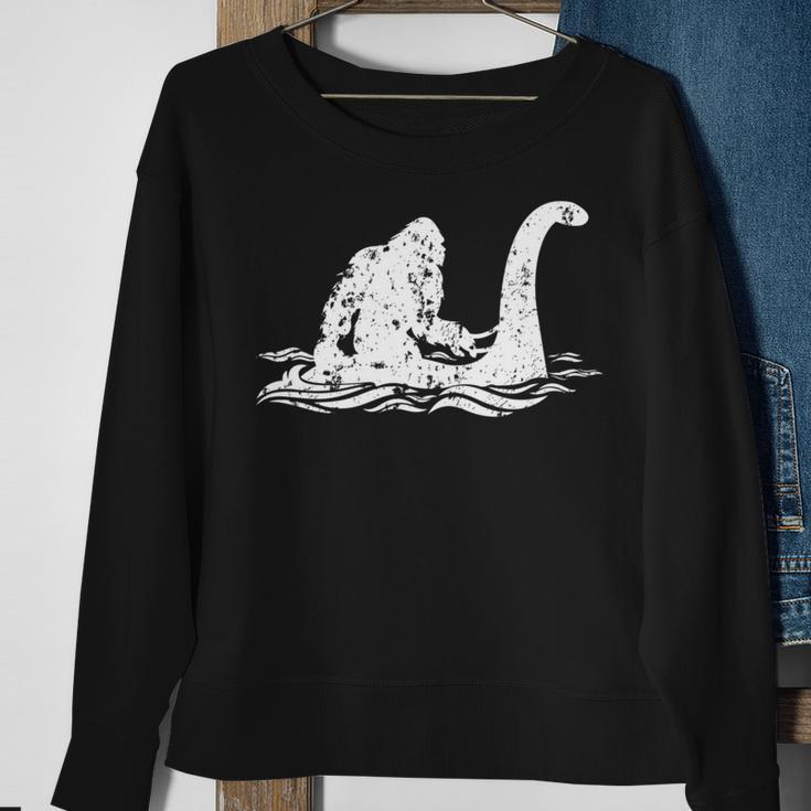 Bigfoot Riding On Nessie Lochness Monster Nessie Yeti Hunter Sweatshirt Gifts for Old Women