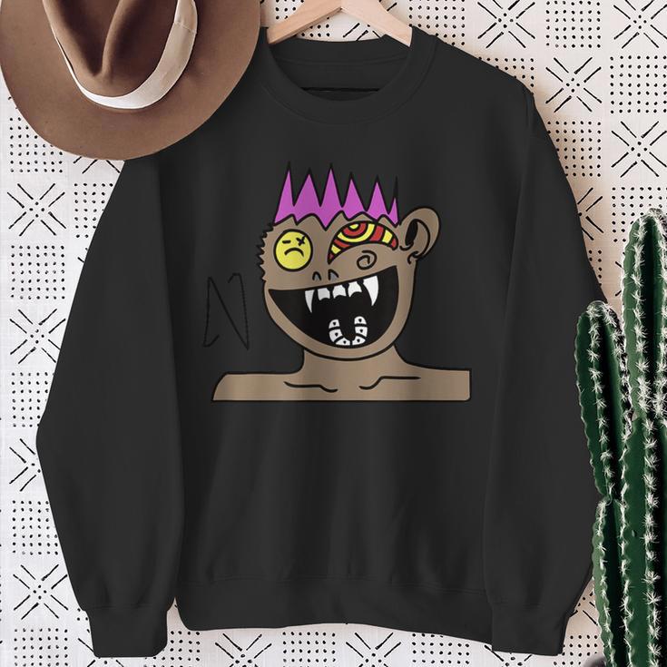 Funky Monster Gesicht Sweatshirt Schwarz mit Farbakzenten Geschenke für alte Frauen