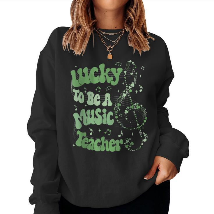Retro Groovy Lucky To Be A Music Teacher St Patrick's Day Women Sweatshirt
