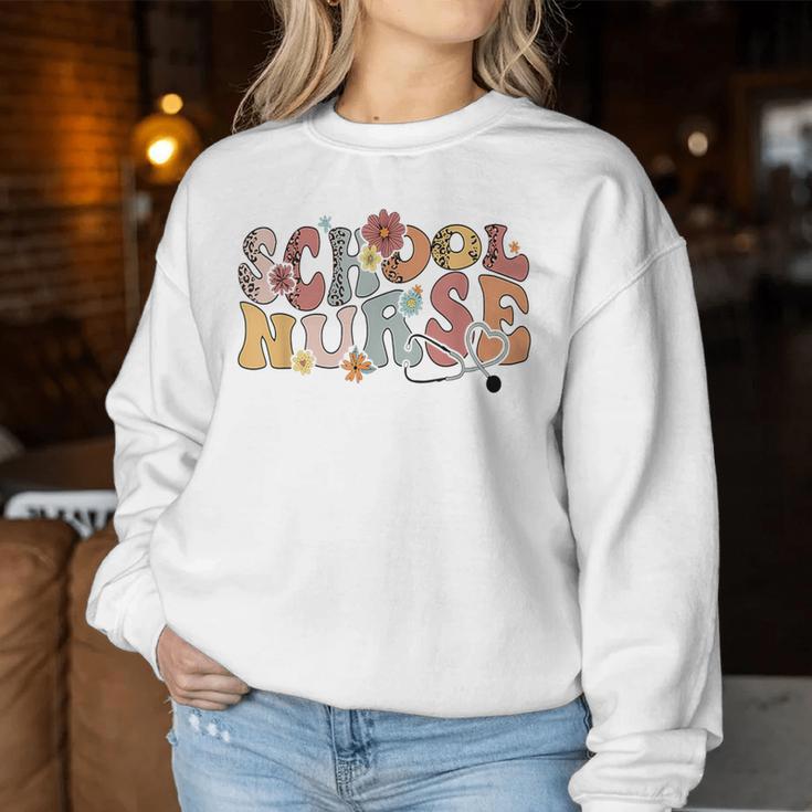 Retro Groovy Floral School Nurse Appreciation Back To School Women Sweatshirt Unique Gifts