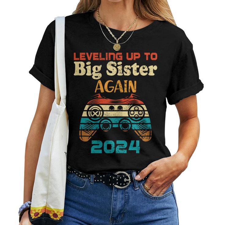 Retro Leveling Up To Big Sister Again 2024 Baby Announcement Women T-shirt