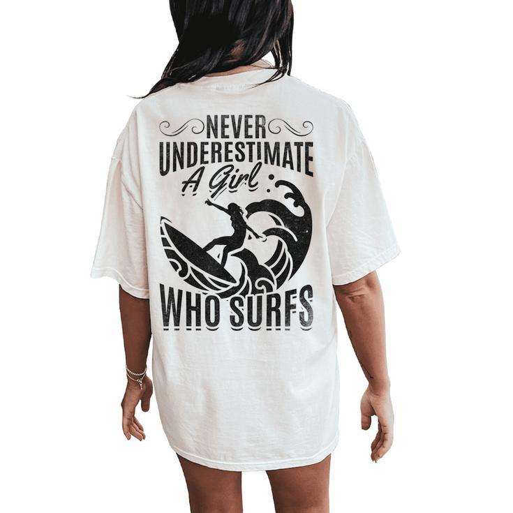 Big Wave Surfing Girls Never Underestimate A Girl Who Surfs Women's Oversized Comfort T-Shirt Back Print