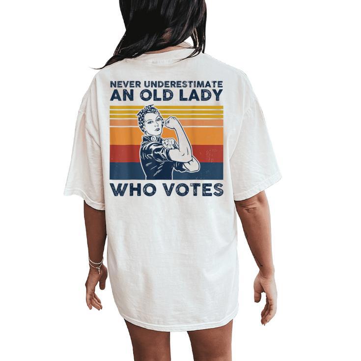 Never Underestimate An Old Lady Who Votes Feminist Women's Oversized Comfort T-Shirt Back Print