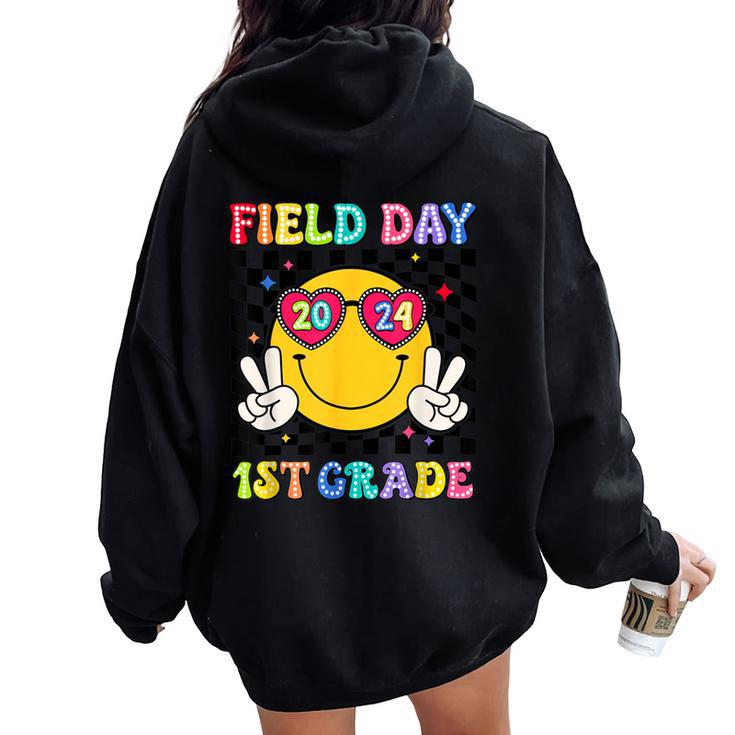 Field Day 2024 1St Grade Smile Face Teacher Field Trip Women Oversized Hoodie Back Print