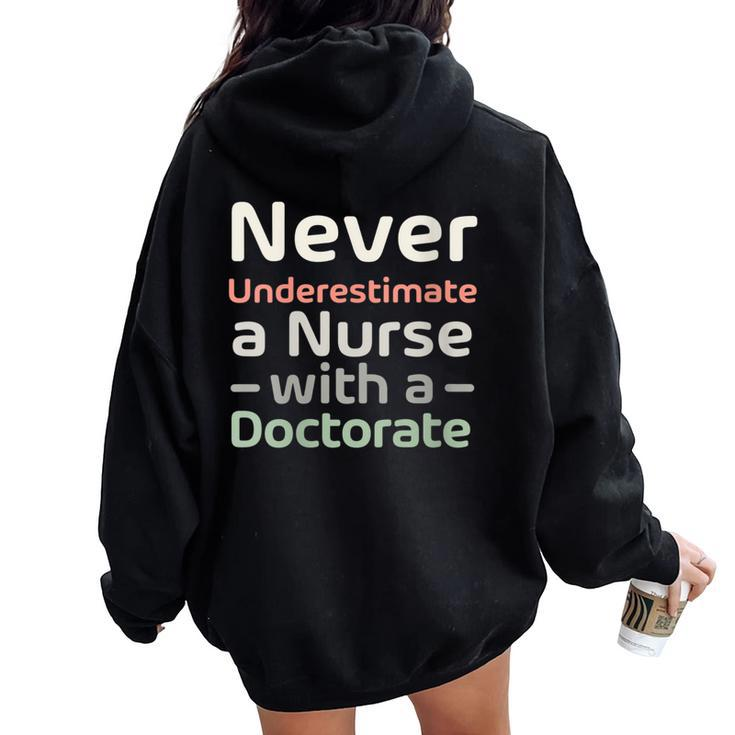 Never Underestimate A Nurse With A Doctorate Women Oversized Hoodie Back Print