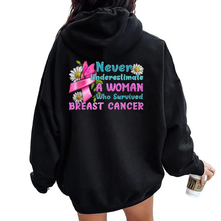 Never Underestimate A Woman Who Survived Breast Cancer Women Oversized Hoodie Back Print