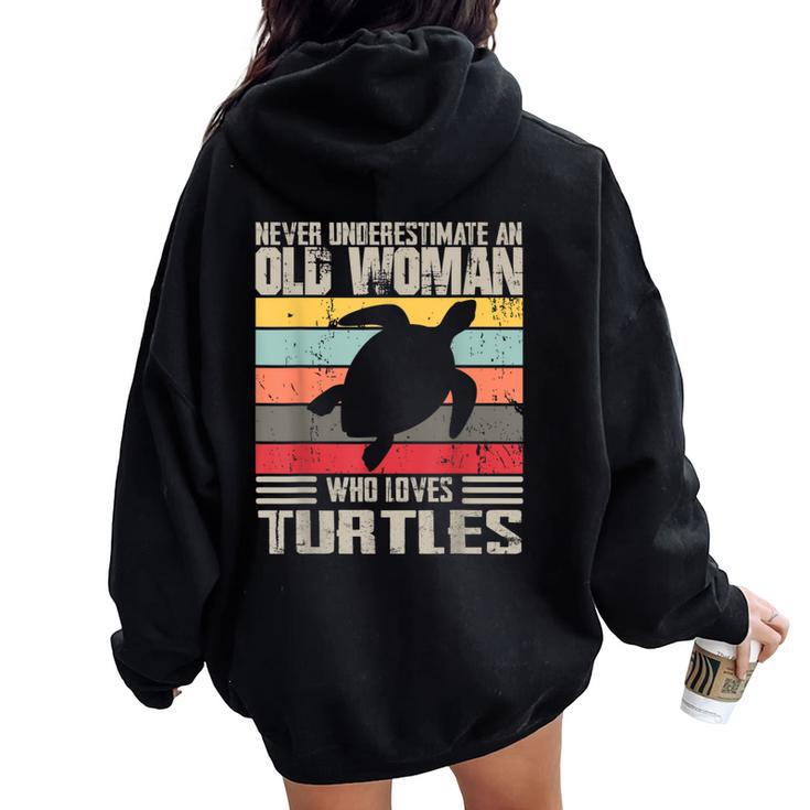 Vintage Never Underestimate An Old Woman Who Loves Turtles Women Oversized Hoodie Back Print