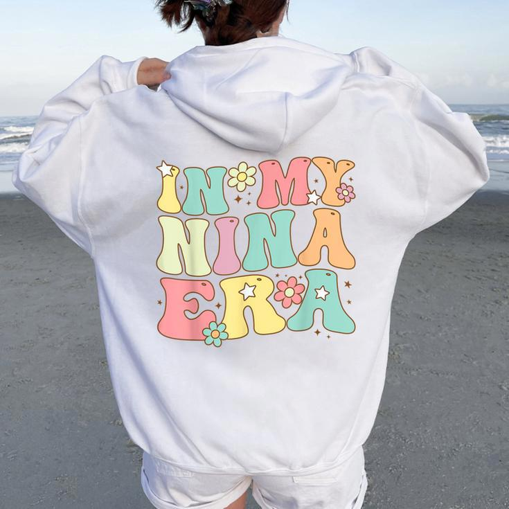Groovy In My Nina Era Nina Retro Women Oversized Hoodie Back Print