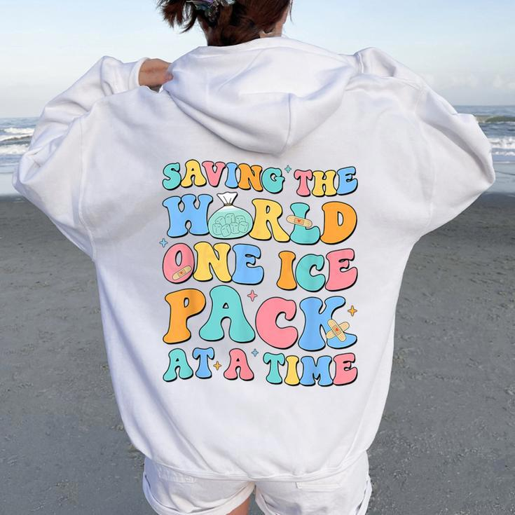 Saving The World One Ice Pack At Time Retro School Nurse Women Oversized Hoodie Back Print