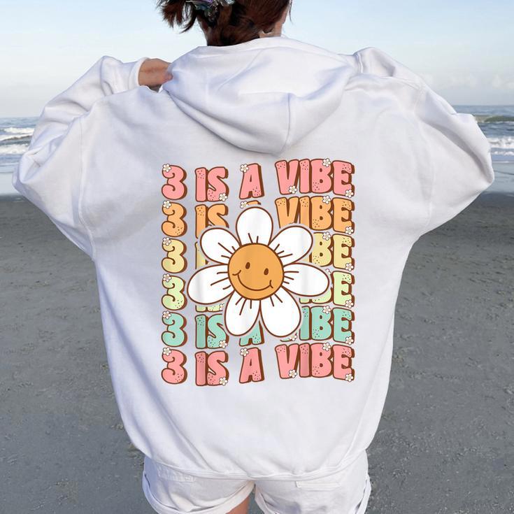 Three Is A Vibe Cute Groovy 3Rd Birthday Party Daisy Flower Women Oversized Hoodie Back Print