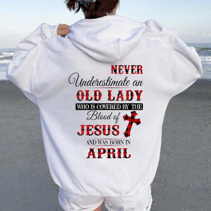 Never Underestimate An Old Lady Love Jesus Born In April Women Oversized Hoodie Back Print