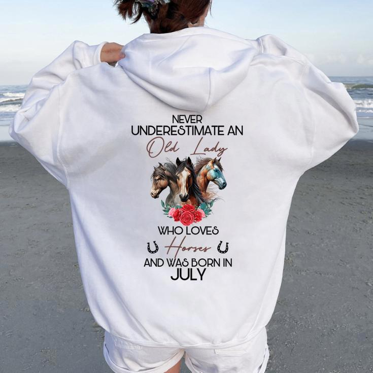Never Underestimate An Old Lady Who Loves Horses July Women Oversized Hoodie Back Print