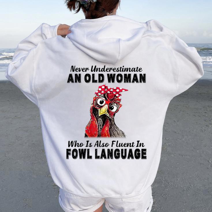 Never Underestimate An Old Woman Fluent In Fowl Language Women Oversized Hoodie Back Print