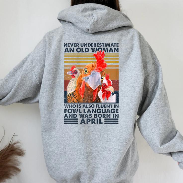 Never Underestimate Old Woman Fluent Fowl Born In April Women Oversized  Hoodie Back Print - Monsterry