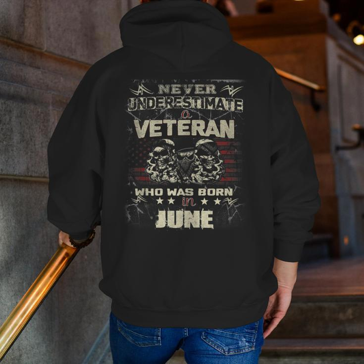 Never Underestimate A Veteran Who Was Born In June Zip Up Hoodie Back Print