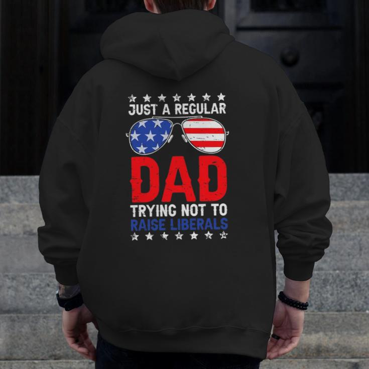Just A Regular Dad Trying Not To Raise Liberals Voted Trump Zip Up Hoodie Back Print