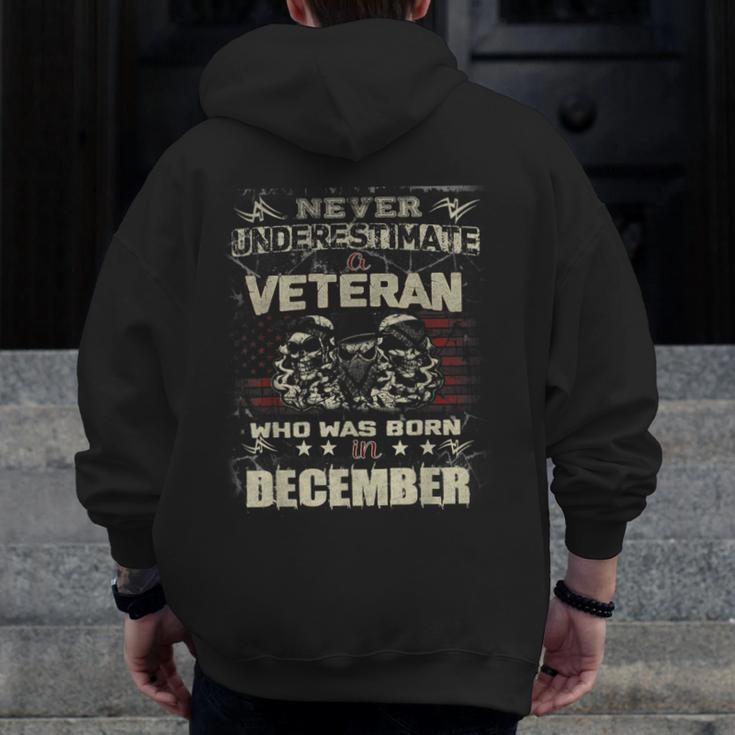 Never Underestimate A Veteran Who Was Born In December Zip Up Hoodie Back Print