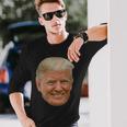 Donald J Trump Das Gesicht Des Präsidenten Auf Einem Meme Langarmshirts Geschenke für Ihn