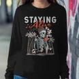 Staying Alive Skeleton Drinking Coffee Lover Addict Skull Women Sweatshirt Unique Gifts