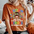Autism Mom Raising Hero Groovy Messy Bun Autism Awareness Women's Oversized Comfort T-Shirt Yam